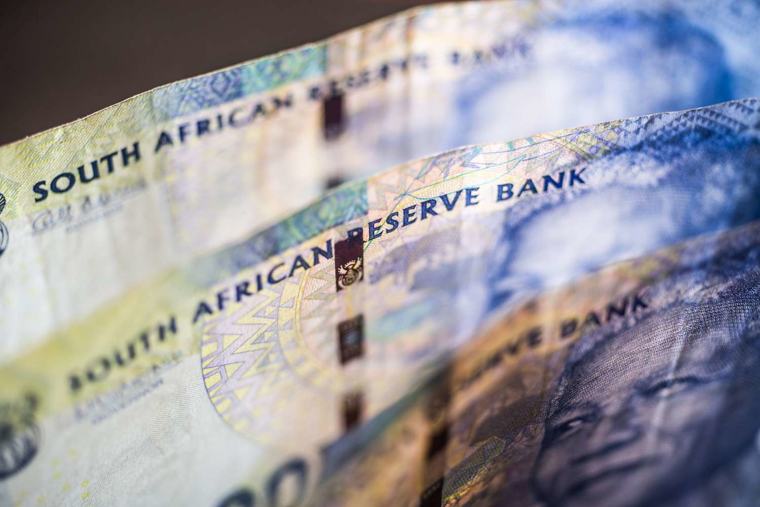 Close-up of South African banknotes featuring the South African Reserve Bank text and currency details
